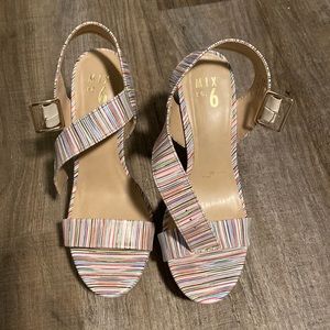 Multi colored high heeled wedges.